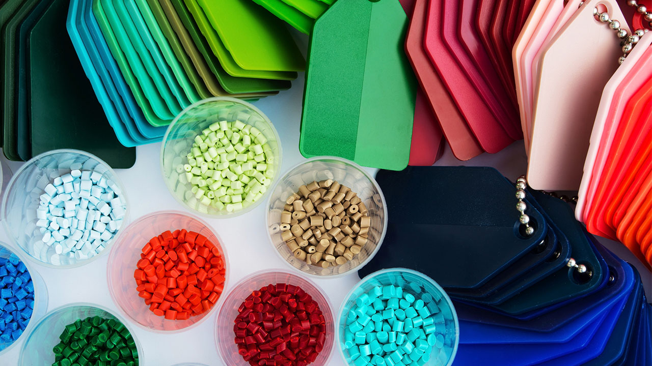  Assorted colorful material samples and tags, showing production asset tracking and quality control in manufacturing.