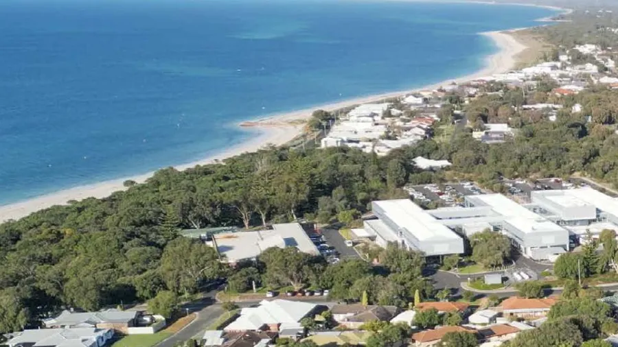 Aerial view of a town with a small coastline